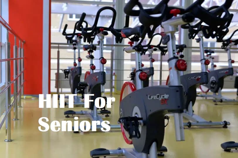 Exercise bikes in a gym with the title HIIT for seniors