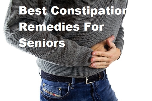A man holding his stomach with the tite Best Constipation Remedies For Seniors