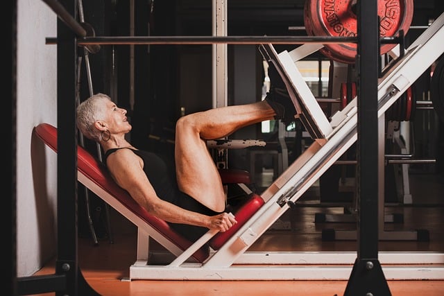 An older woman performing the leg press